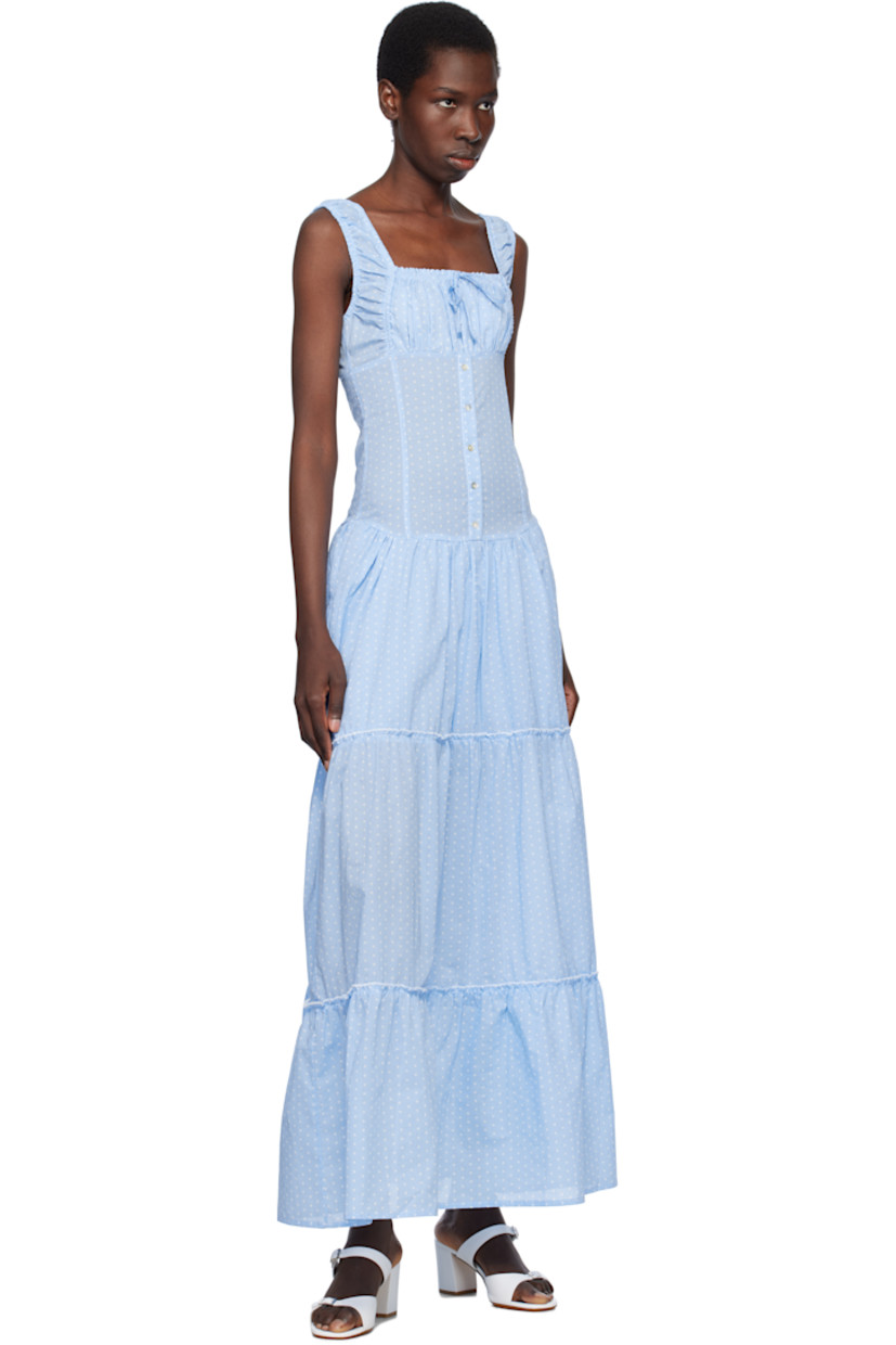Plain-woven cotton dress. Ruffled trim and polka-dot pattern printed throughout.

· Drawstring at elasticized square neck
· Gathering at chest and waist
· Mock button closure
· Tiered skirt 
· Elasticized shoulder straps
· Shirring at back
· Partially lined

Supplier color: Raindrop
