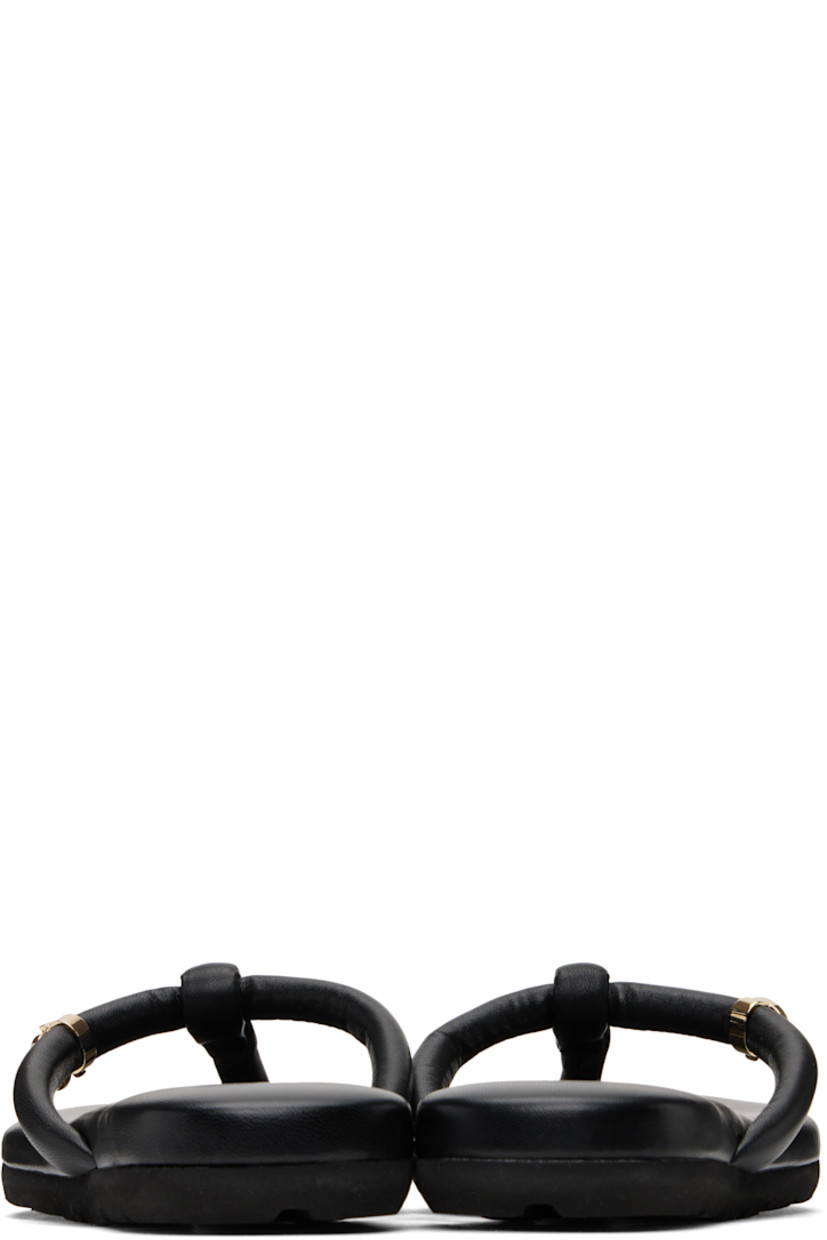 Handcrafted nappa leather flat sandals in black.

· Open toe
· Padded thong-style strap at vamp
· Logo hardware at strap
· Logo stamp at padded footbed
· Treaded rubber sole
· Gold-tone hardware

Supplier color: Black