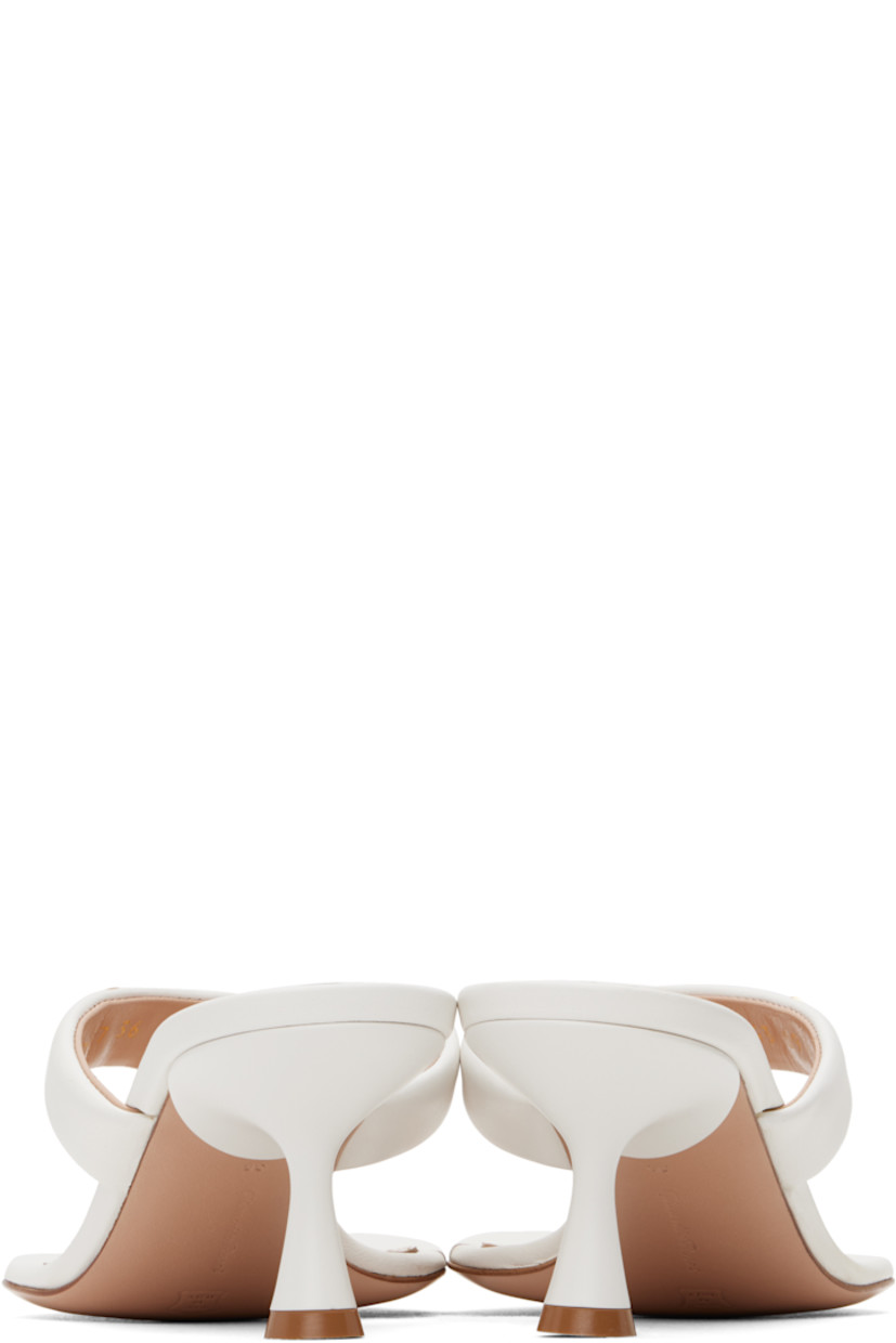 Handcrafted nappa leather heeled sandals in white.

· Open toe
· Thong-style strap at vamp
· Logo hardware at strap
· Logo stamp at padded footbed
· Buffed leather lining
· Lacquered heel with rubber injection
· Polished leather sole
· Gold-tone hardware
· Heel: H2.25"

Supplier color: White