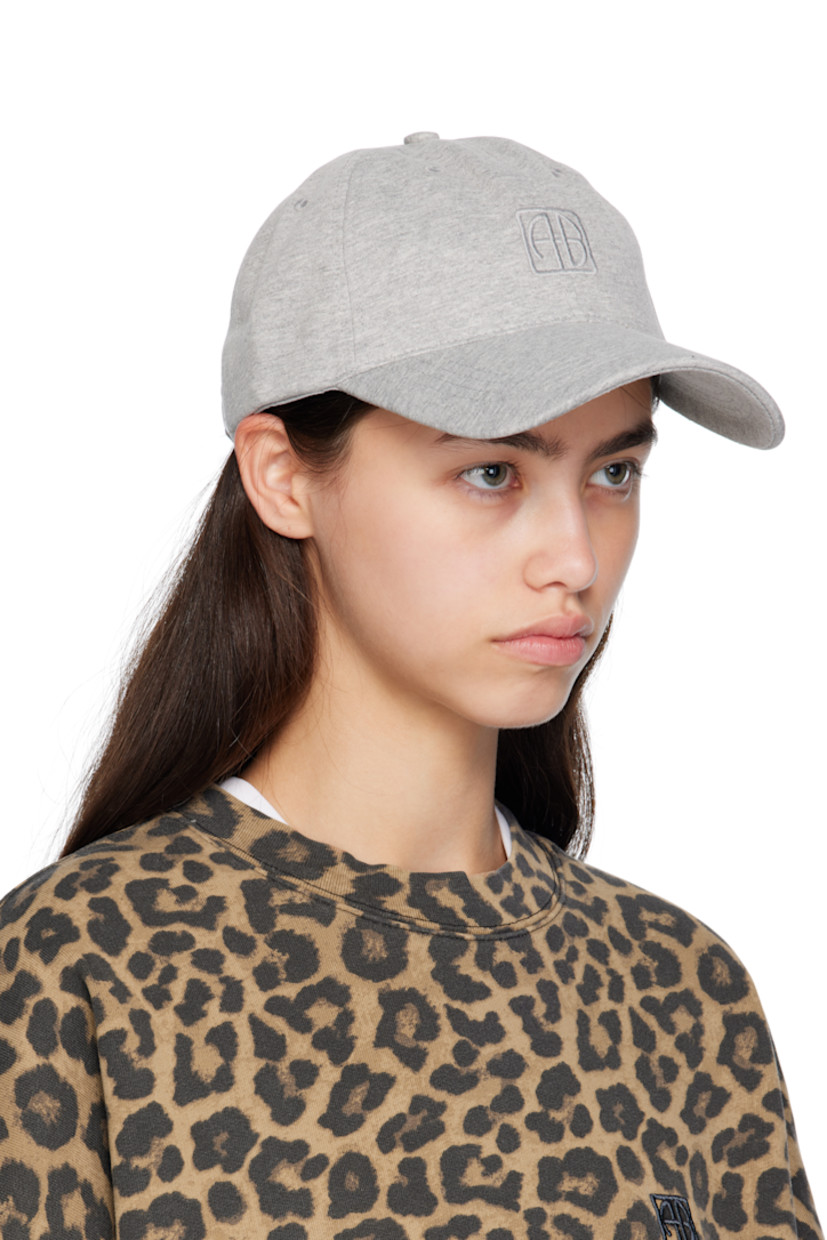 Handcrafted cotton jersey cap.

· Embroidered eyelets at crown
· Logo embroidered at face and back
· Curved brim 
· Cinch fastening
· Jersey browband 

Supplier color: Heather grey