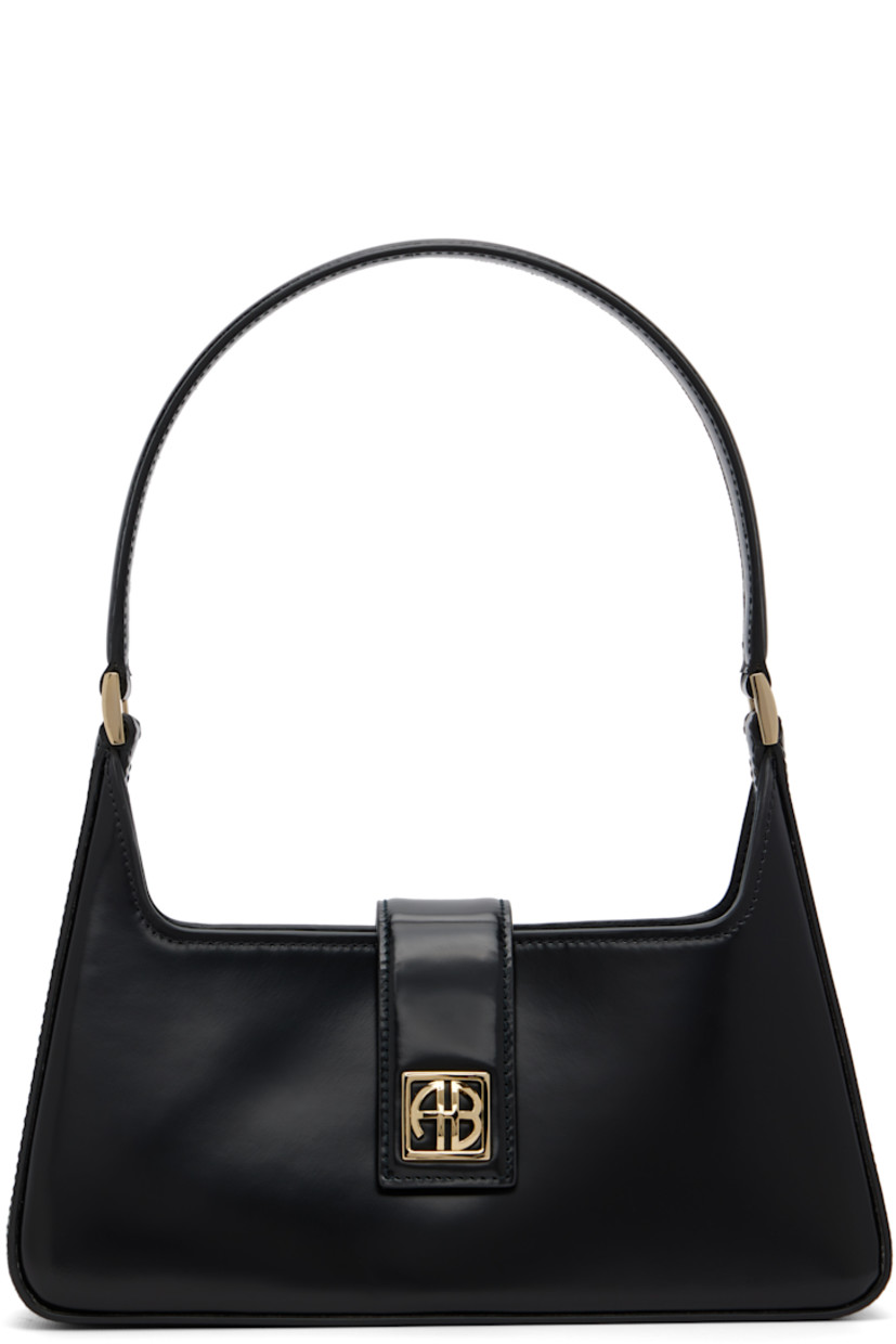 Patent leather shoulder bag.

· Fixed shoulder strap
· Logo hardware at face
· Magnetic foldover flap
· Patch pocket at interior
· Gold tone hardware
· H7” x W10.5” x D7.5”

Supplier color: High-shine Black