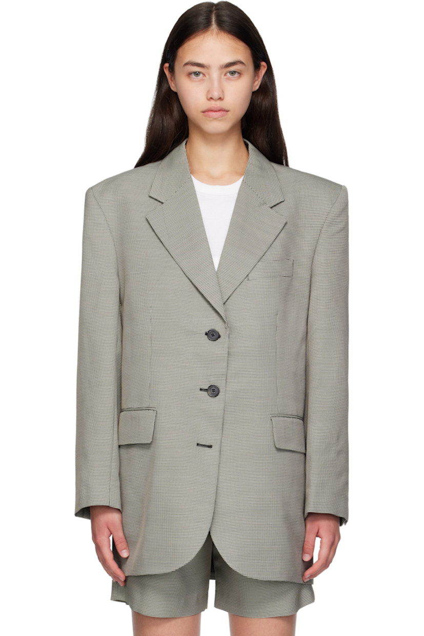 Plain-woven wool- and viscose-blend blazer. 

· Houndstooth pattern throughout 
· Notched lapel 
· Button closure
· Welt pocket at chest
· Flap pockets at front 
· Padded shoulders
· Buttoned surgeon's cuffs
· Central vent at back hem 
· Welt pockets at interior 
· Full viscose-blend satin lining

Supplier color: Black/White mini houndstooth