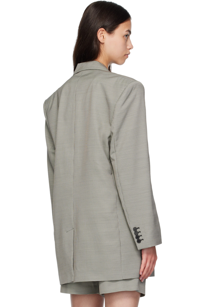 Plain-woven wool- and viscose-blend blazer. 

· Houndstooth pattern throughout 
· Notched lapel 
· Button closure
· Welt pocket at chest
· Flap pockets at front 
· Padded shoulders
· Buttoned surgeon's cuffs
· Central vent at back hem 
· Welt pockets at interior 
· Full viscose-blend satin lining

Supplier color: Black/White mini houndstooth