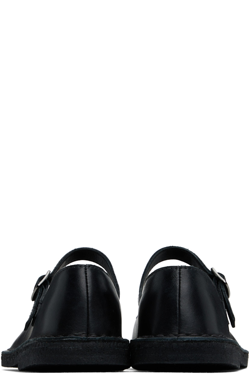 Buffed leather Mary Jane-style ballerina flats in black.

· Pin-buckle strap at vamp
· Suede and buffed leather lining
· Topstitching at welt
· FSC-certified crêpe-rubber sole

Supplier color: Black leather