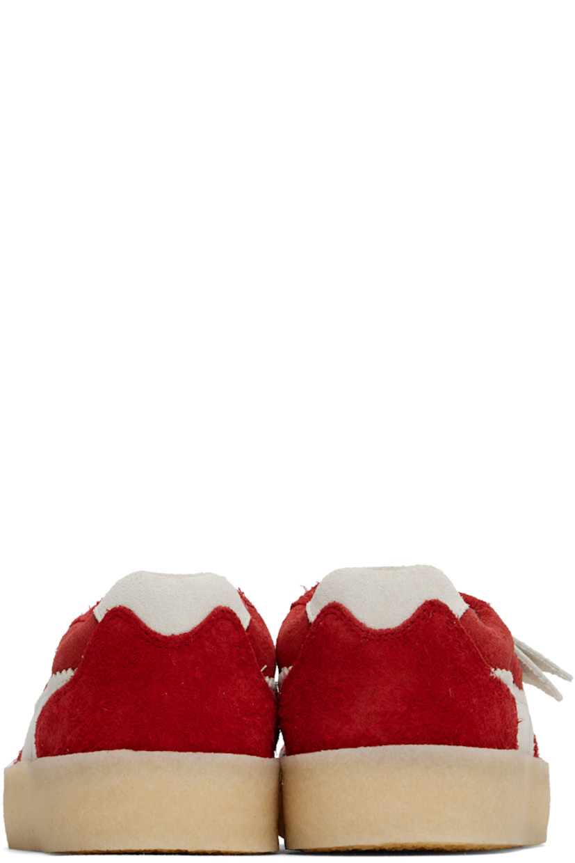 Low-top suede sneakers in red. 

· Logo tags at lace-up closure
· Logo embossed at tongue
· Padded collar
· Appliqué with serrated edges at sides
· Suede lining
· FSC-certified crêpe-rubber sole

Supplier color: Red combination