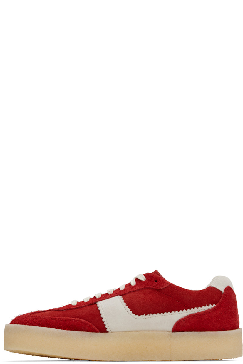 Low-top suede sneakers in red. 

· Logo tags at lace-up closure
· Logo embossed at tongue
· Padded collar
· Appliqué with serrated edges at sides
· Suede lining
· FSC-certified crêpe-rubber sole

Supplier color: Red combination