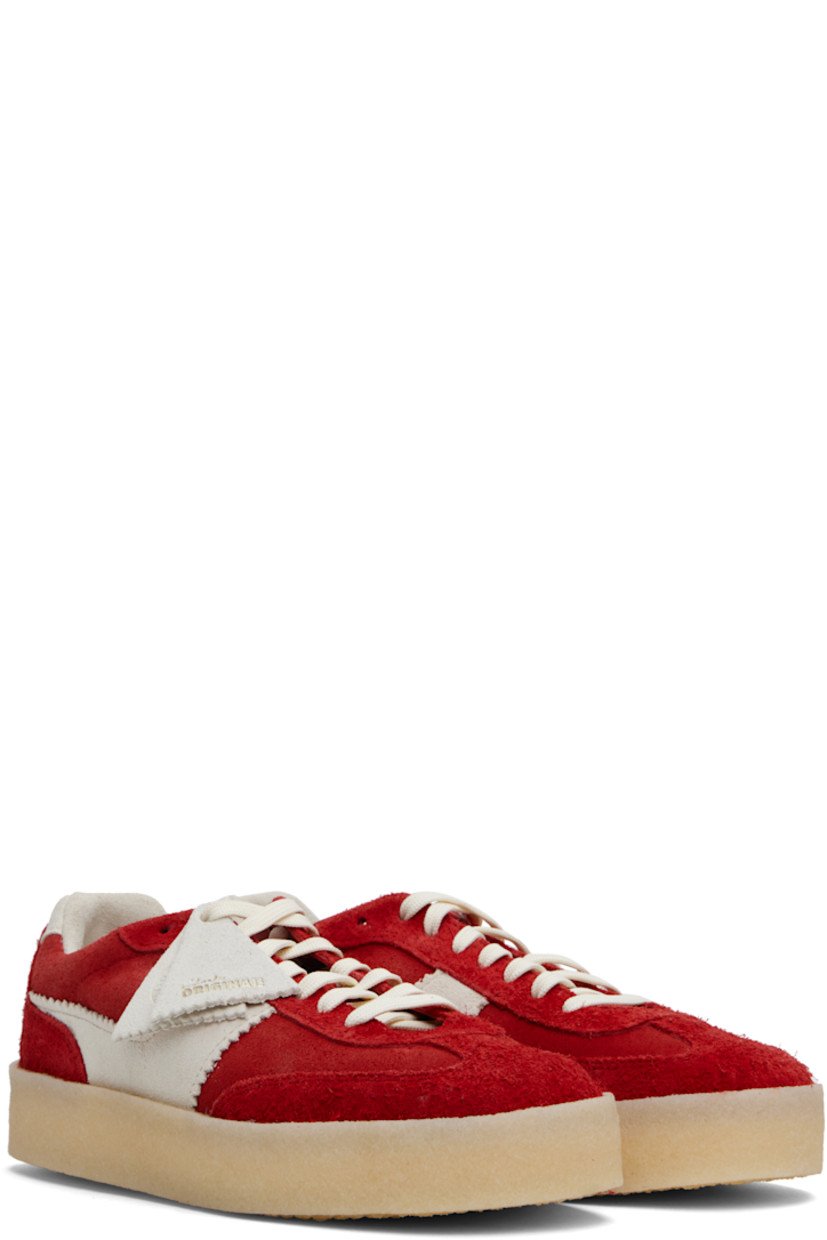Low-top suede sneakers in red. 

· Logo tags at lace-up closure
· Logo embossed at tongue
· Padded collar
· Appliqué with serrated edges at sides
· Suede lining
· FSC-certified crêpe-rubber sole

Supplier color: Red combination