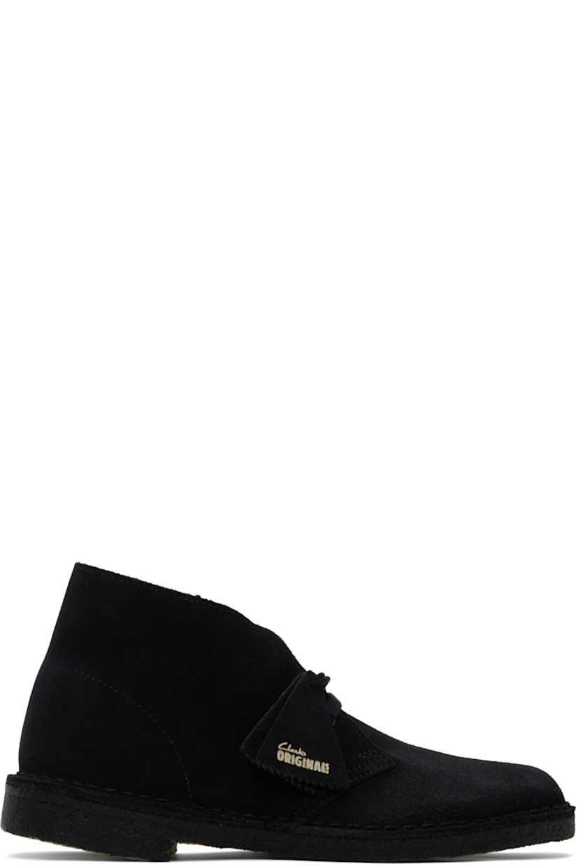 Ankle-high suede desert boots in black.

· Logo tags at lace-up closure
· Buffed leather lining
· Topstitching at welt
· FSC-certified crepe rubber sole

Supplier color: Black suede