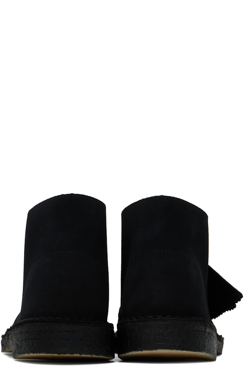 Ankle-high suede desert boots in black.

· Logo tags at lace-up closure
· Buffed leather lining
· Topstitching at welt
· FSC-certified crepe rubber sole

Supplier color: Black suede