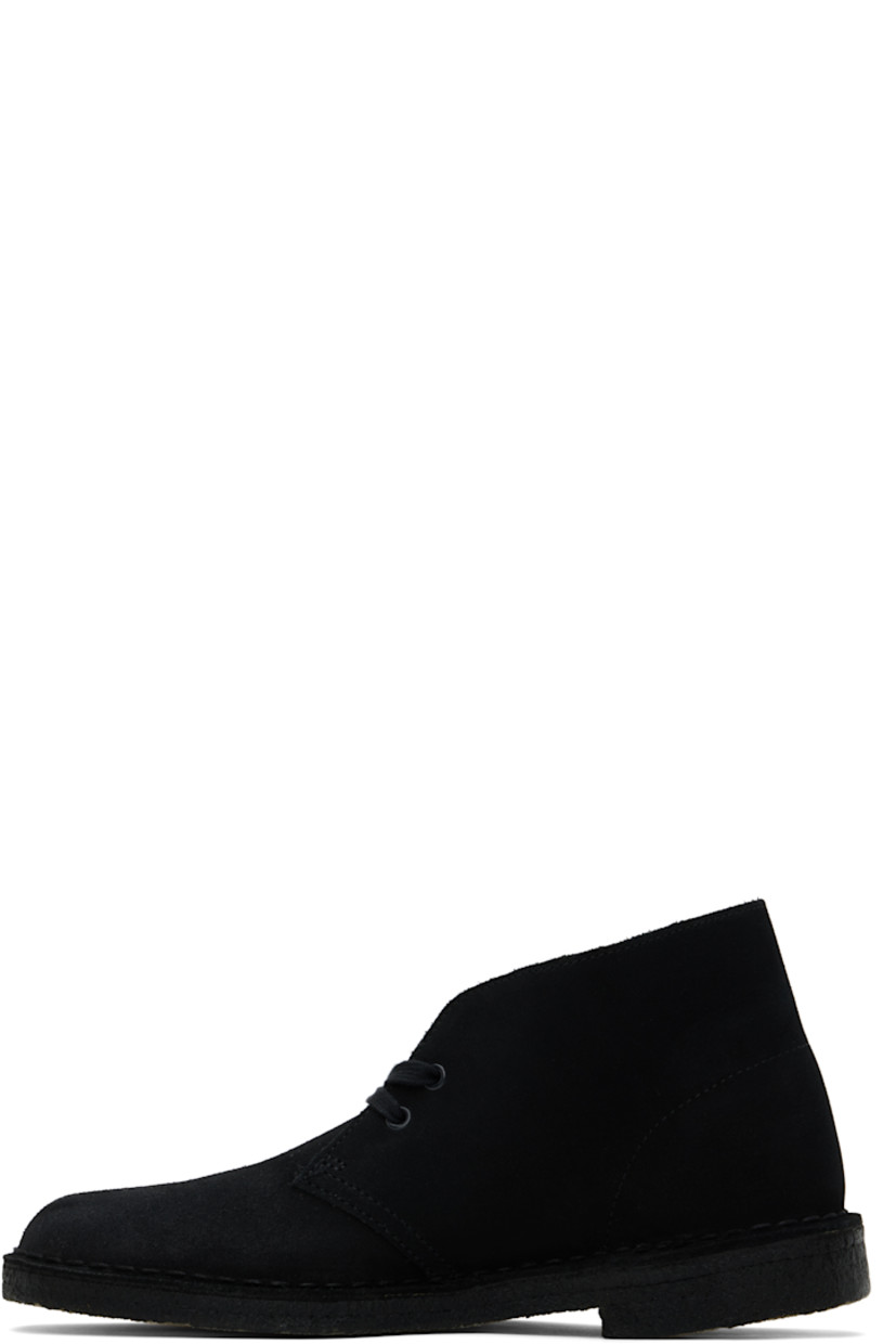 Ankle-high suede desert boots in black.

· Logo tags at lace-up closure
· Buffed leather lining
· Topstitching at welt
· FSC-certified crepe rubber sole

Supplier color: Black suede