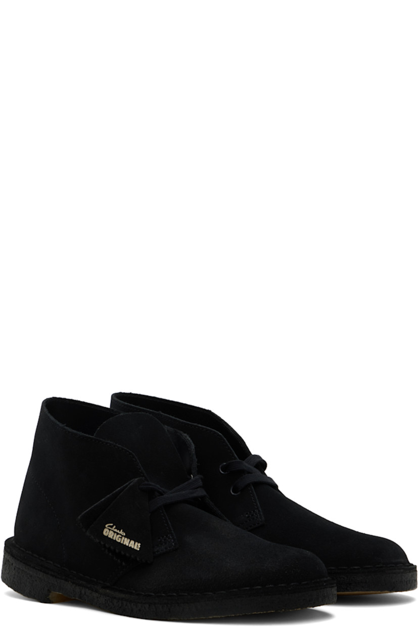 Ankle-high suede desert boots in black.

· Logo tags at lace-up closure
· Buffed leather lining
· Topstitching at welt
· FSC-certified crepe rubber sole

Supplier color: Black suede