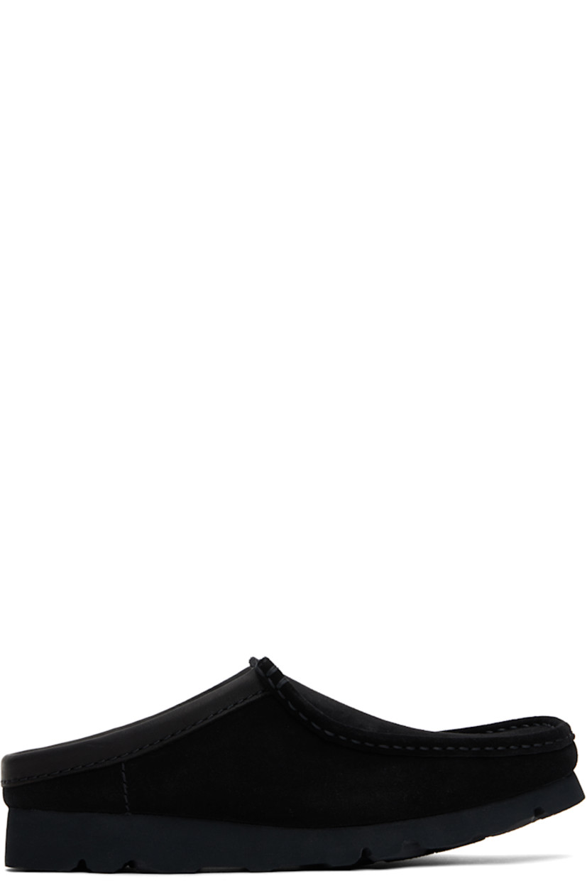 Suede slip-on loafers in black.

· Square moc toe
· Logo stamp at molded footbed
· Suede and grained leather lining
· Treaded Vibram® rubber sole

Supplier color: Black suede