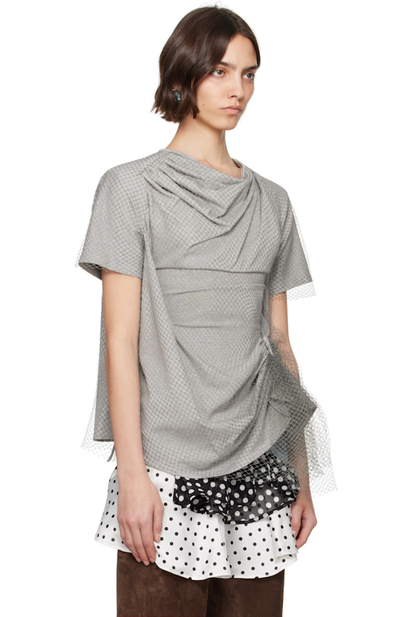 Cotton jersey T-shirt. Draping throughout.

· Nylon fishnet overlay
· Cowl neck
· Ruching at front 
· Asymmetric hem
· Padded saddle shoulders
· Box pleat at back collar

Supplier color: Grey/Baby blue