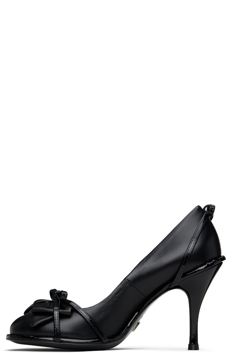 Nappa leather heels in black.

· Straps and bow accents at vamp
· Bow accent at heel
· Stiletto heel with rubber injection
· Leather sole 
· Heel: H3.5"

Supplier color: Black