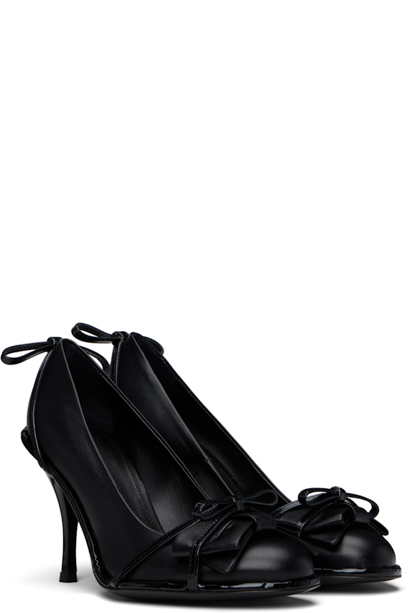 Nappa leather heels in black.

· Straps and bow accents at vamp
· Bow accent at heel
· Stiletto heel with rubber injection
· Leather sole 
· Heel: H3.5"

Supplier color: Black