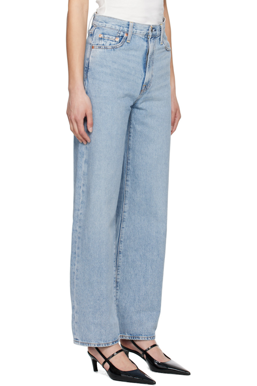 Wide-leg non-stretch denim jeans. Fading and whiskering throughout.

· High-rise
· Belt loops
· Five-pocket styling
· Zip fly
· Leather logo patch at back waistband
· Logo flag at back pocket
· Logo-engraved silver- and copper-tone hardware
· Contrast stitching in tan

Supplier color: Far and wide