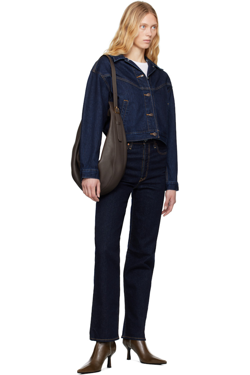 Straight-leg and slim-fit stretch denim jeans.

· High-rise
· Belt loops
· Five-pocket styling
· Button fly
· Leather logo patch at back waistband
· Logo flag at back pocket
· Logo-engraved silver- and copper-tone hardware
· Contrast stitching in tan

Supplier color: Small course