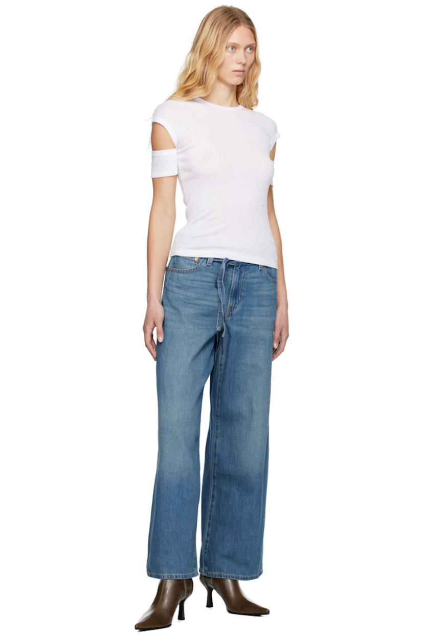 Lightweight non-stretch cotton- and linen-blend denim jeans. Fading and whiskering throughout.

· Oversized and straight-leg 
· Mid-rise
· Belt loops
· Detachable self-tie belt
· Five-pocket styling
· Zip fly
· Logo patch at back waistband
· Logo flag at back pocket
· Logo-engraved silver- and copper-tone hardware
· Contrast stitching in tan

Supplier color: Stop flaxing