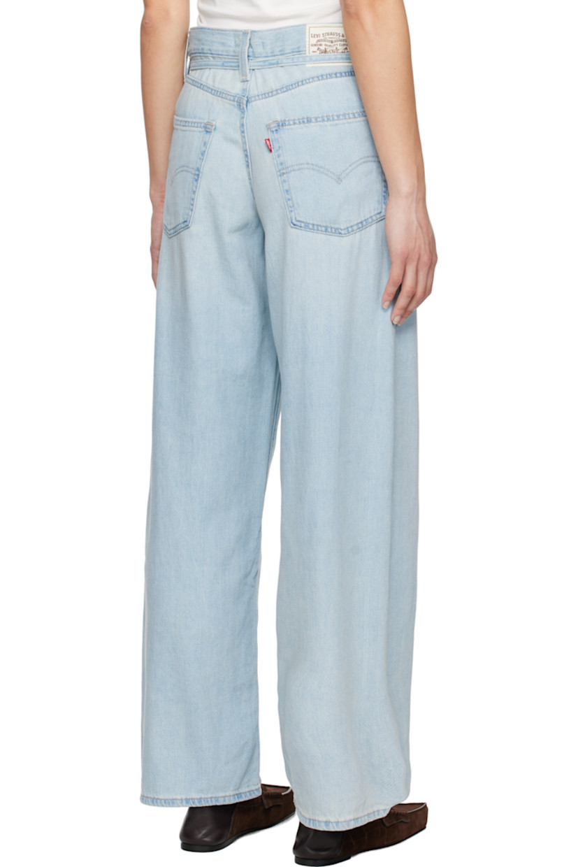 Lightweight non-stretch cotton- and linen-blend denim jeans. Fading and whiskering throughout.

· Oversized and straight-leg 
· Mid-rise
· Belt loops
· Detachable self-tie belt
· Five-pocket styling
· Zip fly
· Logo patch at back waistband
· Logo flag at back pocket
· Logo-engraved silver- and copper-tone hardware

Supplier color: Luxury trip