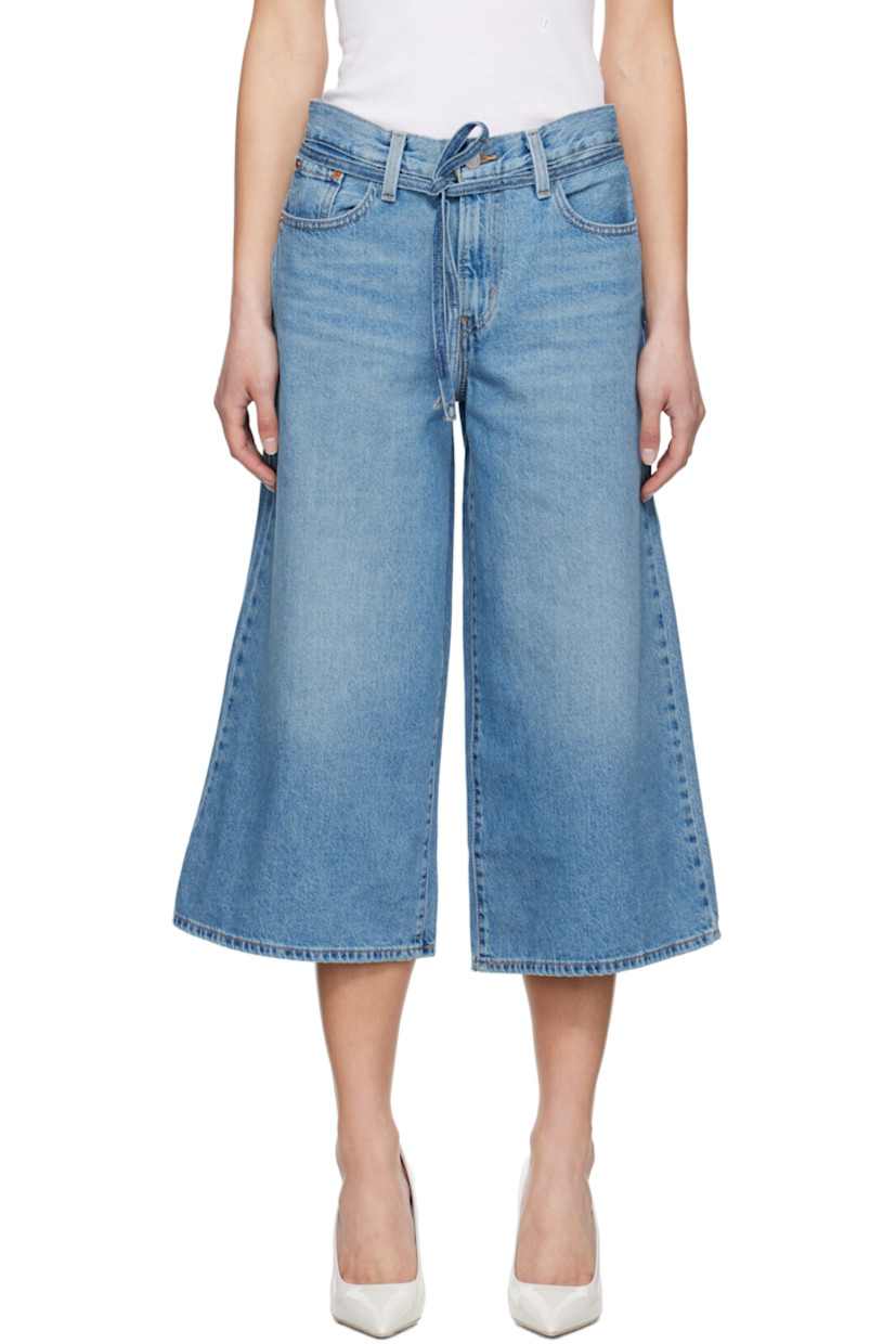 Oversized wide-leg non-stretch denim jeans. Fading and whiskering throughout.

· Mid-rise
· Belt loops
· Detachable self-tie belt
· Five-pocket styling
· Zip fly
· Cropped flared legs
· Leather logo patch at back waistband
· Logo flag at back pocket
· Logo-engraved silver- and copper-tone hardware
· Contrast stitching in tan

Supplier color: Hot and cold