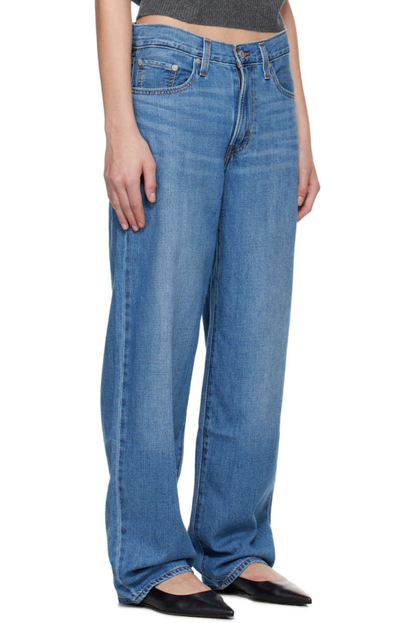 Non-stretch cotton- and linen-blend denim jeans. Fading and whiskering throughout.

· Loose-fit and straight-leg
· Mid-rise
· Five-pocket styling
· Zip fly
· Logo patch at back waistband
· Logo flag at back pocket
· Logo-engraved silver-tone hardware
· Contrast stitching in tan 

Supplier color: Heavy check/Medium wash