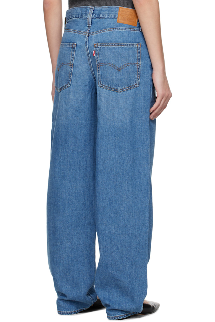 Non-stretch cotton- and linen-blend denim jeans. Fading and whiskering throughout.

· Loose-fit and straight-leg
· Mid-rise
· Five-pocket styling
· Zip fly
· Logo patch at back waistband
· Logo flag at back pocket
· Logo-engraved silver-tone hardware
· Contrast stitching in tan 

Supplier color: Heavy check/Medium wash