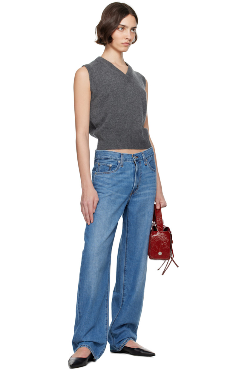Non-stretch cotton- and linen-blend denim jeans. Fading and whiskering throughout.

· Loose-fit and straight-leg
· Mid-rise
· Five-pocket styling
· Zip fly
· Logo patch at back waistband
· Logo flag at back pocket
· Logo-engraved silver-tone hardware
· Contrast stitching in tan 

Supplier color: Heavy check/Medium wash