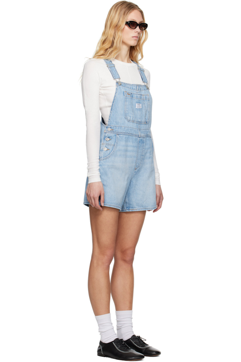 Loose-fit non-stretch denim overalls. Fading, whiskering, and subtle distressing throughout.

· Square neck
· Patch pocket with logo patch at chest
· Four-pocket styling
· Mock fly
· Button fastening at outseams
· Adjustable shoulder straps
· Logo flag at back pocket
· Logo-engraved silver-tone hardware
· Contrast stitching in tan

Supplier color: Summer job/Light wash