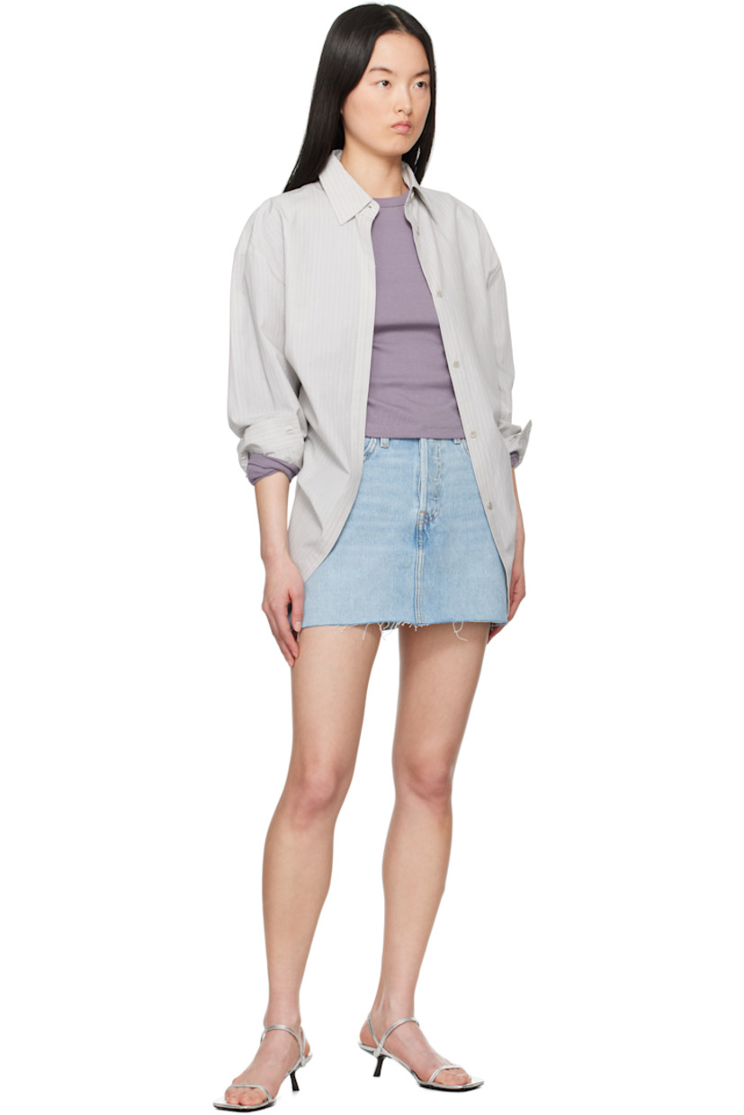 Non-stretch denim miniskirt. Fading and whiskering throughout.

· Mid-rise
· Belt loops
· Five-pocket styling
· Button fly
· Distressing at hem
· Leather logo patch at back waistband
· Logo flag at back pocket
· Logo-engraved silver- and bronze-tone hardware
· Contrast stitching in tan

Supplier color: Woven minutes