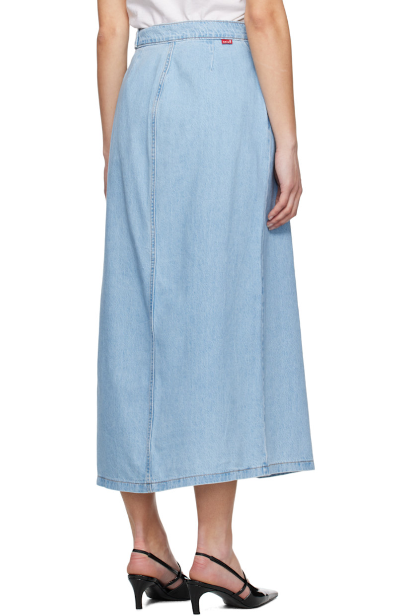 Non-stretch denim maxi skirt. Fading throughout.

· Wrap construction
· Mid-rise
· Button fastening and integrated cinch belt
· Two-pocket styling
· Logo flag and darts at back
· Contrast stitching in tan

Supplier color: Wrapped in blue