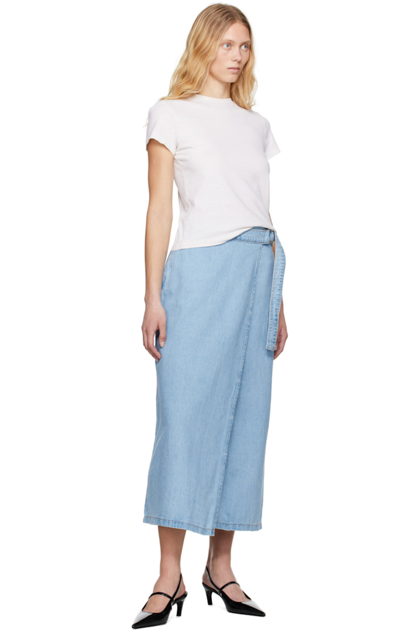 Non-stretch denim maxi skirt. Fading throughout.

· Wrap construction
· Mid-rise
· Button fastening and integrated cinch belt
· Two-pocket styling
· Logo flag and darts at back
· Contrast stitching in tan

Supplier color: Wrapped in blue