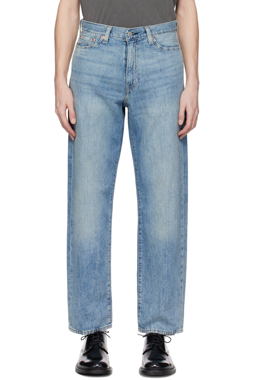 Lightweight non-stretch cotton- and linen-blend denim jeans. Fading and whiskering throughout. 

· Loose-fit and straight-leg
· Mid-rise
· Belt loops
· Five-pocket styling
· Zip fly
· Leather logo patch at back waistband
· Logo flag at back pocket
· Logo-engraved silver- and copper-tone hardware
· Contrast stitching in tan

Supplier color: At the laundromat