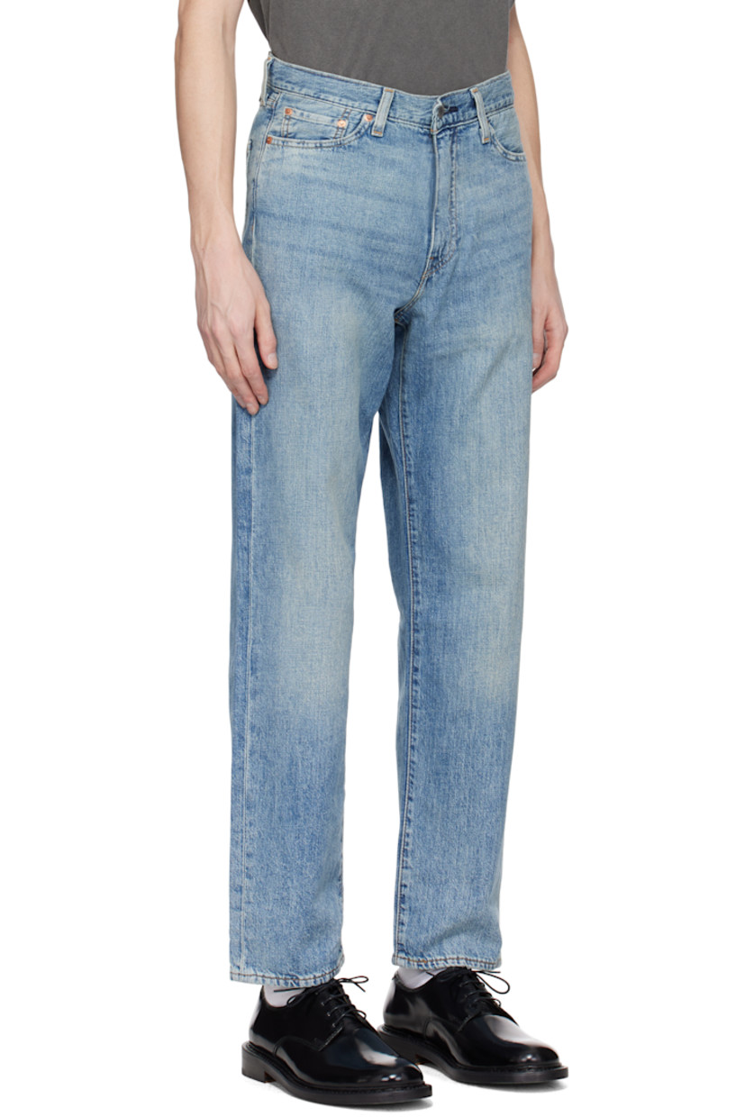 Lightweight non-stretch cotton- and linen-blend denim jeans. Fading and whiskering throughout. 

· Loose-fit and straight-leg
· Mid-rise
· Belt loops
· Five-pocket styling
· Zip fly
· Leather logo patch at back waistband
· Logo flag at back pocket
· Logo-engraved silver- and copper-tone hardware
· Contrast stitching in tan

Supplier color: At the laundromat