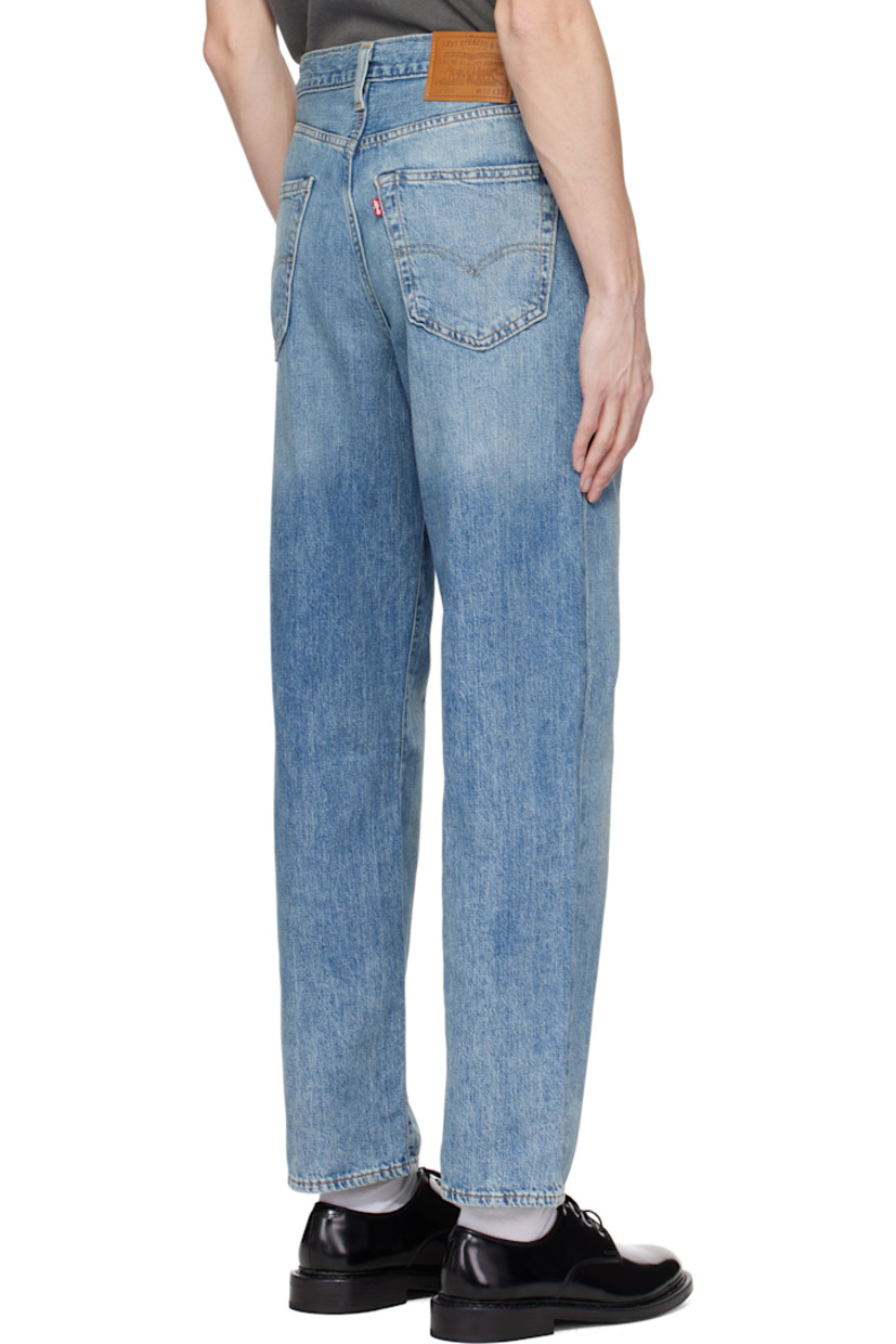 Lightweight non-stretch cotton- and linen-blend denim jeans. Fading and whiskering throughout. 

· Loose-fit and straight-leg
· Mid-rise
· Belt loops
· Five-pocket styling
· Zip fly
· Leather logo patch at back waistband
· Logo flag at back pocket
· Logo-engraved silver- and copper-tone hardware
· Contrast stitching in tan

Supplier color: At the laundromat