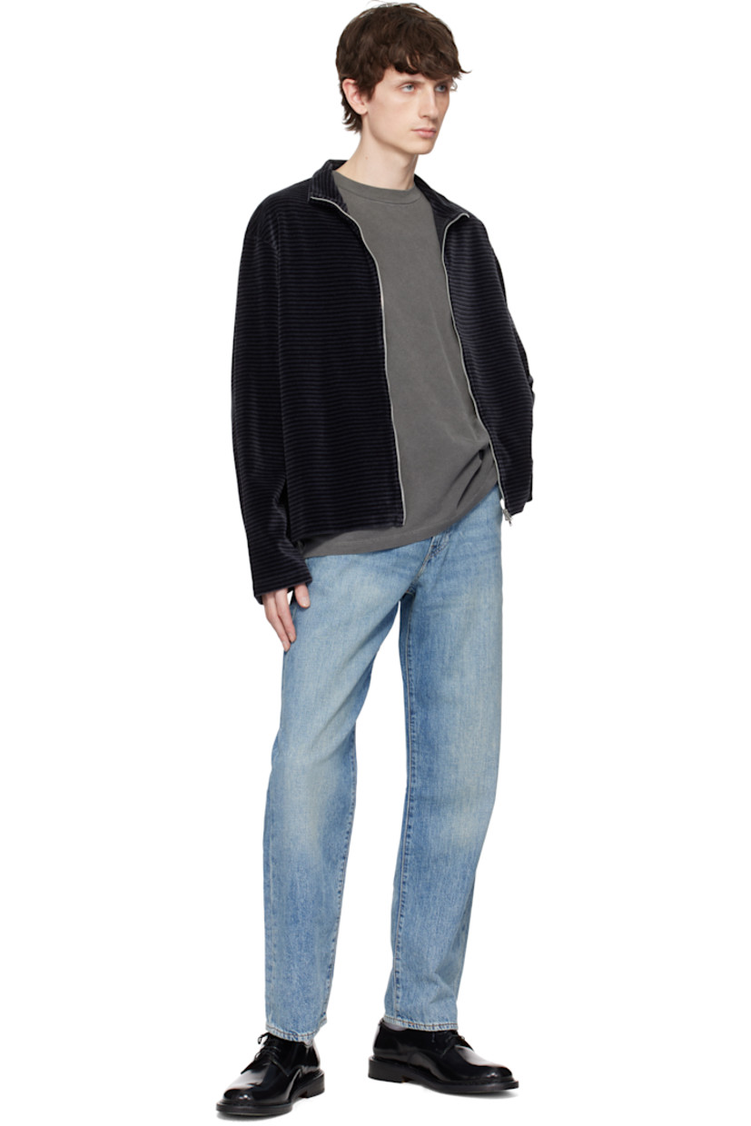 Lightweight non-stretch cotton- and linen-blend denim jeans. Fading and whiskering throughout. 

· Loose-fit and straight-leg
· Mid-rise
· Belt loops
· Five-pocket styling
· Zip fly
· Leather logo patch at back waistband
· Logo flag at back pocket
· Logo-engraved silver- and copper-tone hardware
· Contrast stitching in tan

Supplier color: At the laundromat