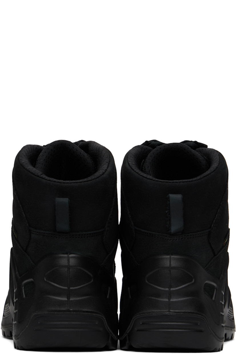 Mid-top GORE-TEX® nubuck and grained leather sneakers in black.

· Lightweight, waterproof, and tear-resistant
· Logo printed at vamp and outer side
· Concealed lace-up closure
· Padded tongue and collar
· Pull-loop at heel tab
· Mesh lining
· MONOWRAP stability frame at midsole
· Treaded X-TRAC® rubber sole

Part of the AFFXWRKS x LOWA collaboration.

Supplier color: Black/Black