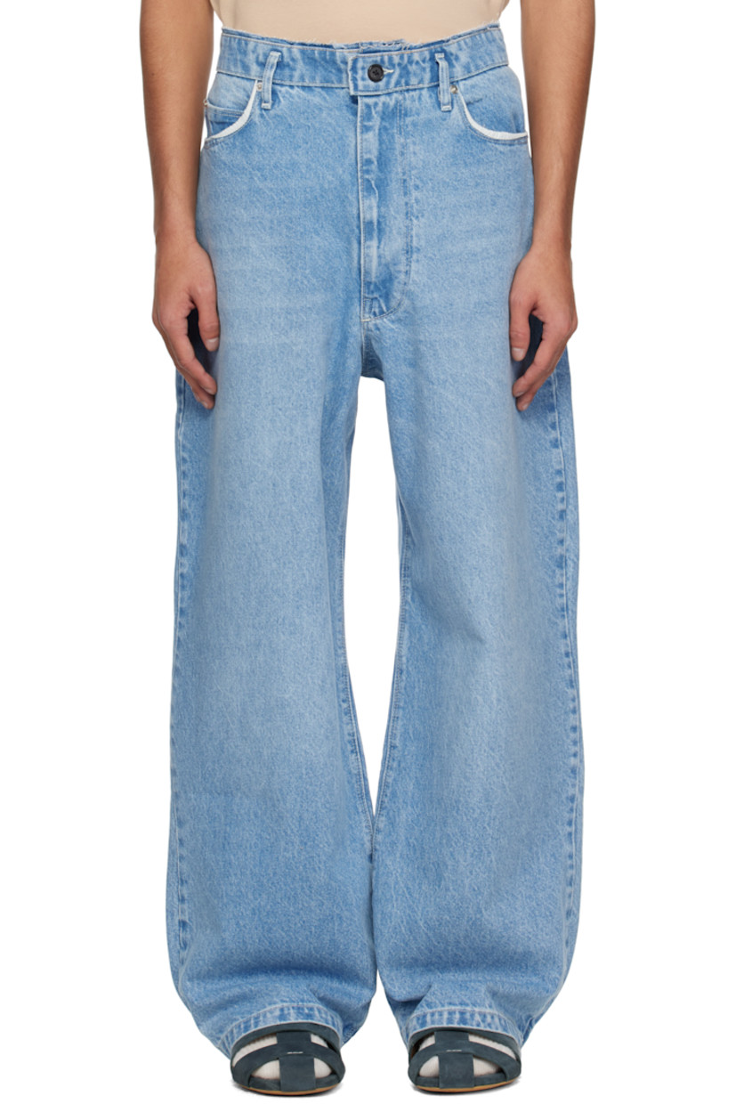 Loose-fit and wide-leg non-stretch denim jeans. Fading and whiskering throughout.

· Raw edge at waistband
· Belt loops
· Five-pocket styling
· Zip fly
· Partially exposed pocket lining
· Dropped inseam
· Horn and logo-engraved silver-tone hardware

Supplier color: Light blue