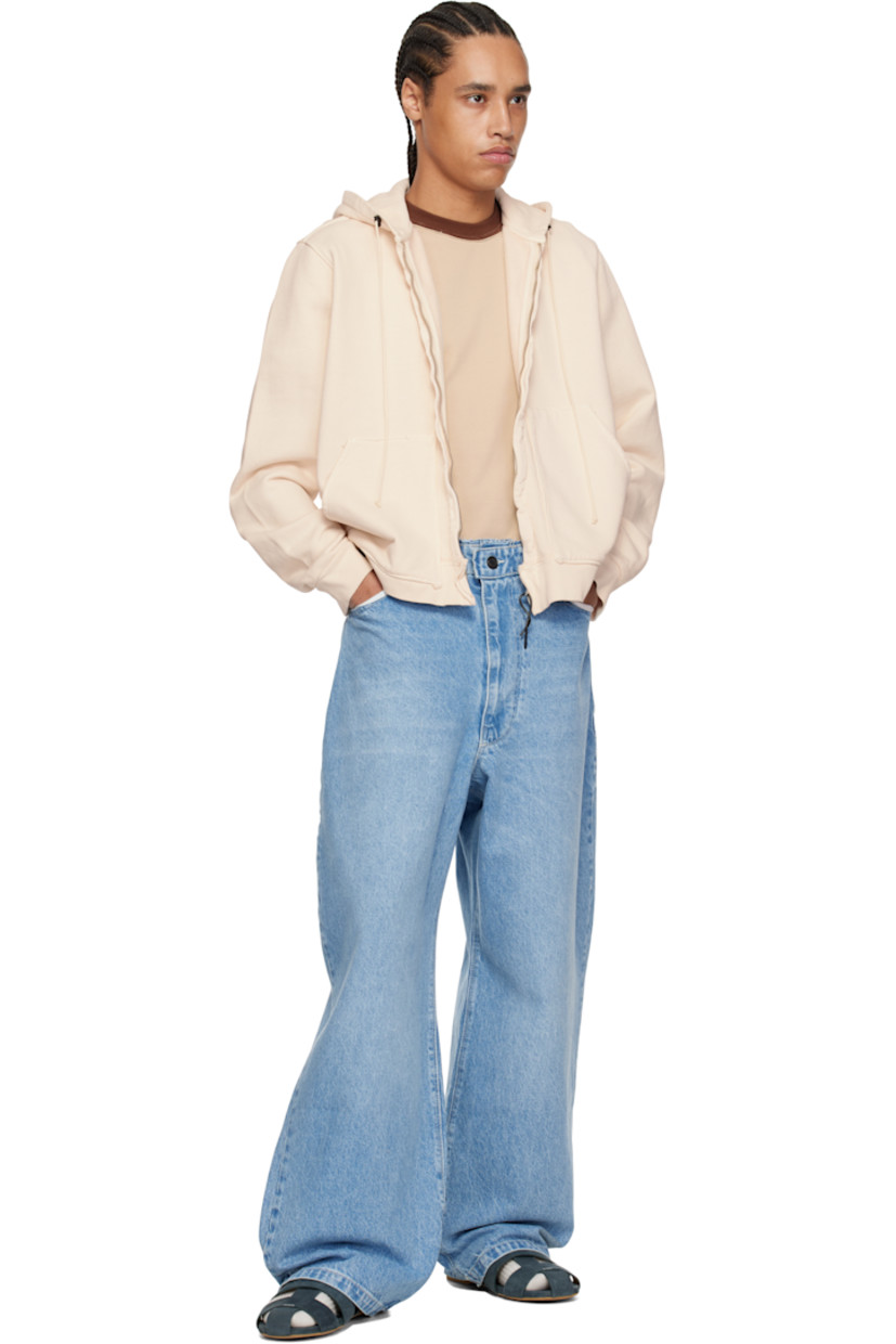 Loose-fit and wide-leg non-stretch denim jeans. Fading and whiskering throughout.

· Raw edge at waistband
· Belt loops
· Five-pocket styling
· Zip fly
· Partially exposed pocket lining
· Dropped inseam
· Horn and logo-engraved silver-tone hardware

Supplier color: Light blue