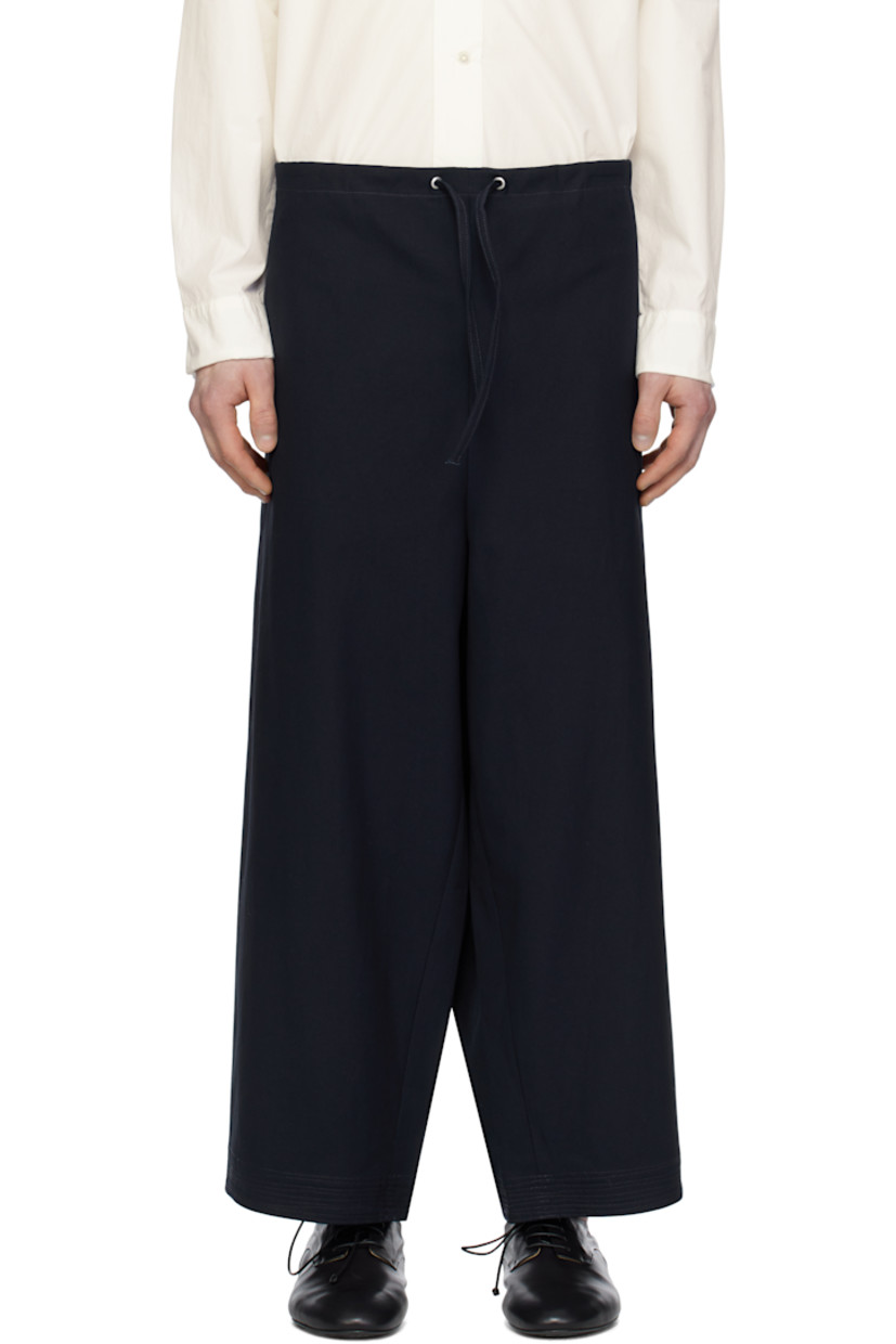 Cotton canvas trousers. 

· Drawstring at waistband 
· Two-pocket styling 
· Embroidered detailing at cuffs 
· Gusset at inseam 

Supplier color: Canvas navy