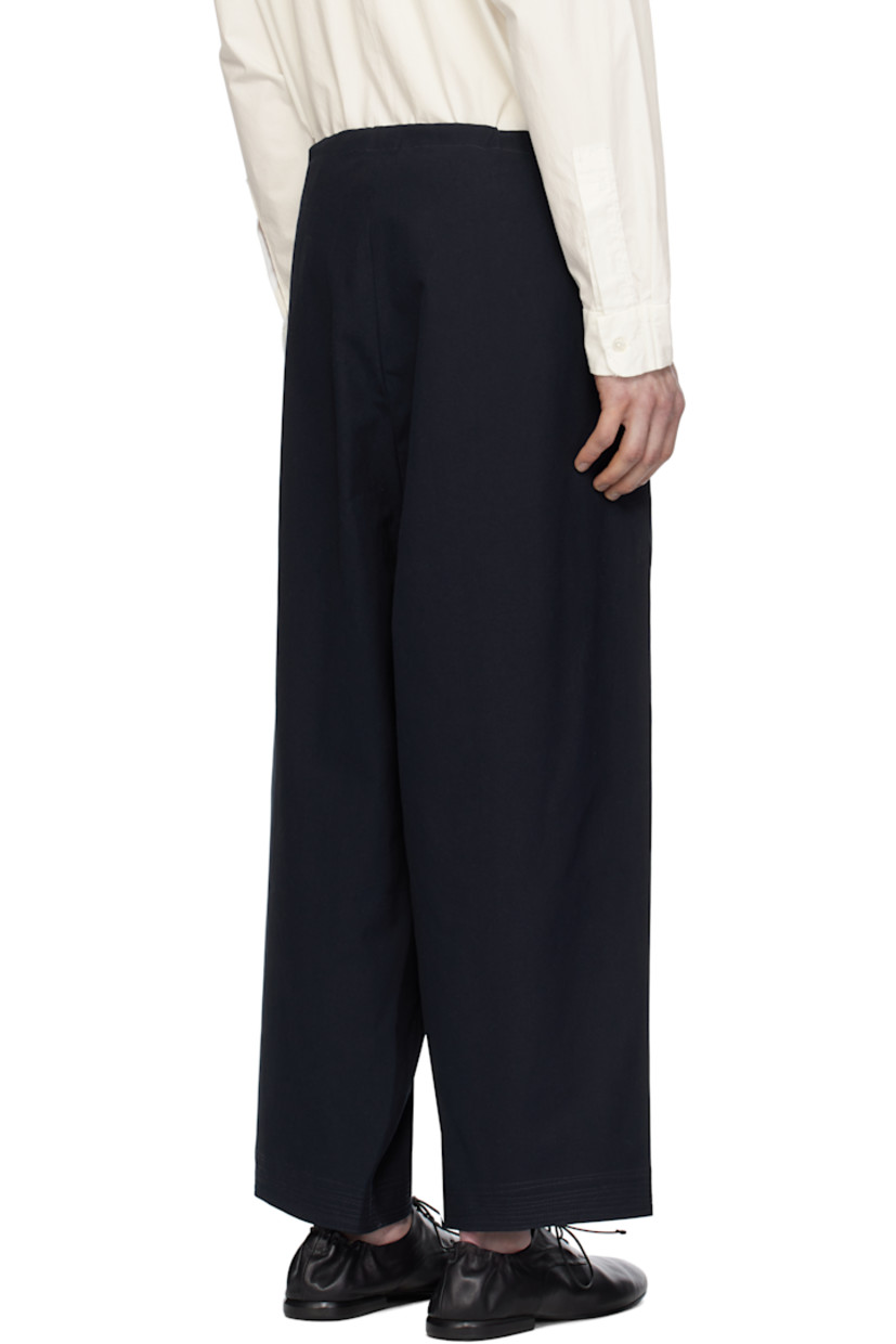 Cotton canvas trousers. 

· Drawstring at waistband 
· Two-pocket styling 
· Embroidered detailing at cuffs 
· Gusset at inseam 

Supplier color: Canvas navy