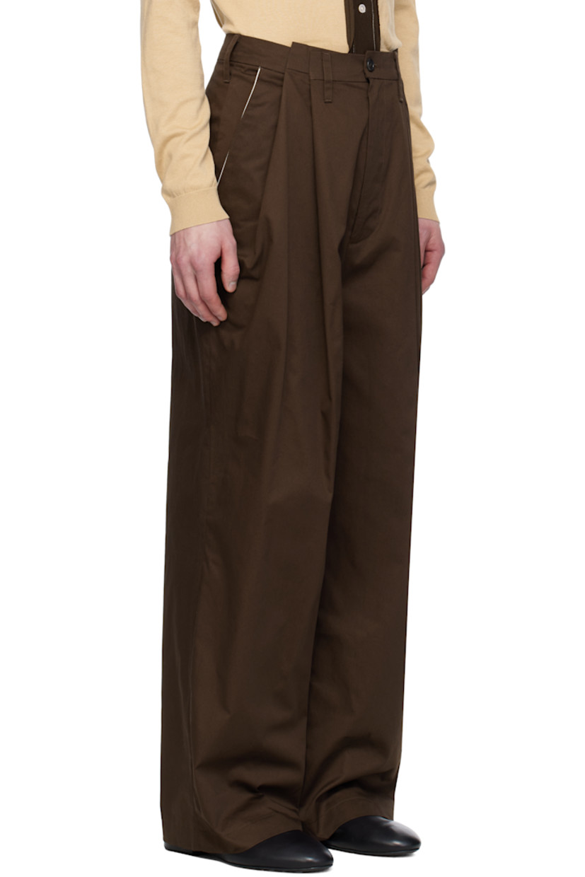 Wide straight-leg cotton twill trousers. 

· Belt loops 
· Three-pocket styling 
· Zip fly 
· Asymmetric pleats at front 
· Dropped inseam
· Darts at back waistband 
· Horn hardware 

Supplier color: Brown