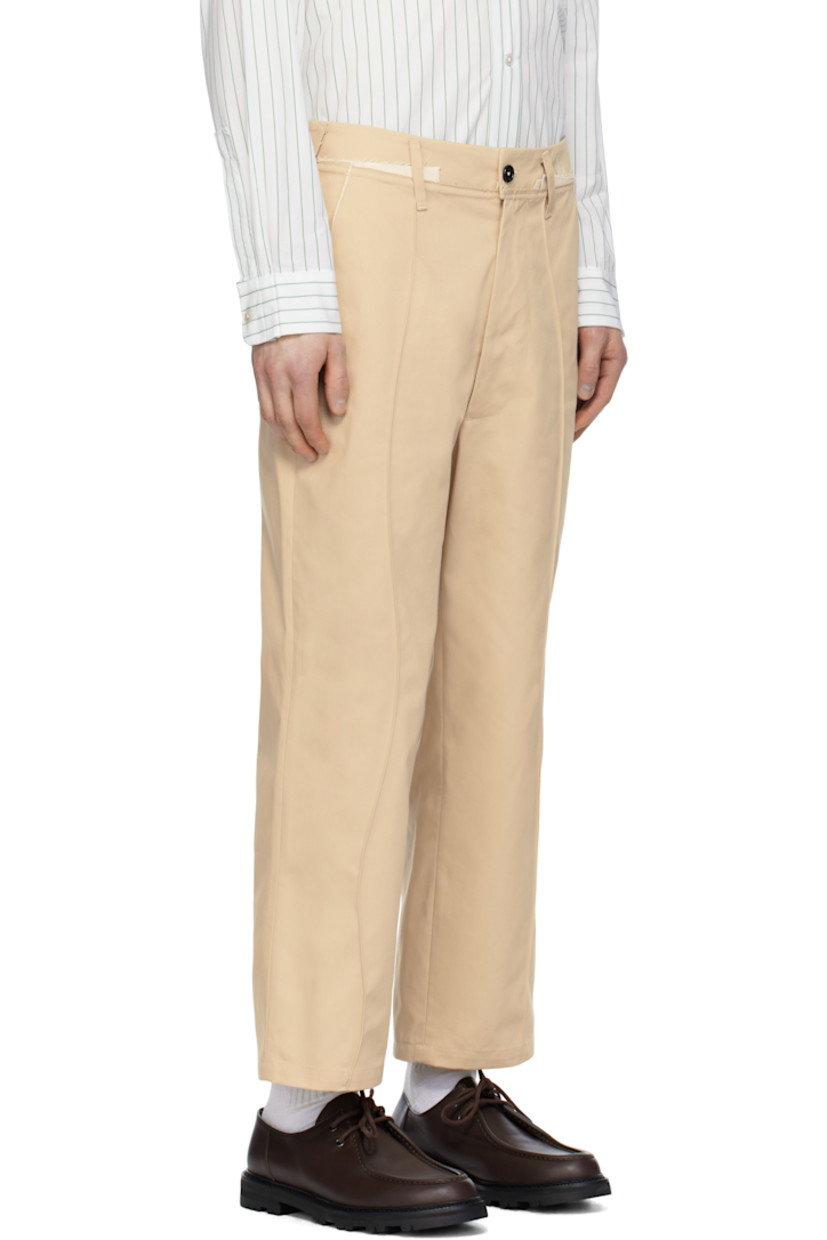 Loose-fit straight-leg cotton twill trousers.

· Belt loops
· Frayed edge and exposed plain-woven trim at waistband
· Four-pocket styling
· Zip fly 
· Modified pinched seams at front 
· Horn hardware

Supplier color: Sand