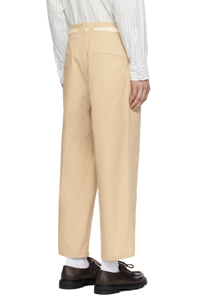 Loose-fit straight-leg cotton twill trousers.

· Belt loops
· Frayed edge and exposed plain-woven trim at waistband
· Four-pocket styling
· Zip fly 
· Modified pinched seams at front 
· Horn hardware

Supplier color: Sand