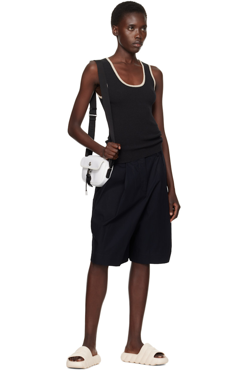 Taffeta pouch in white.

· Adjustable crossbody strap
· Logo hardware and flap pocket at face
· Zip closure
· Zip pocket at interior
· Twill lining
· H5.5" x W8" x D2.25"

Supplier color: Silk white