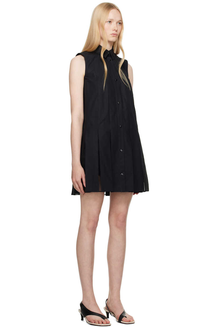 Cotton poplin minidress.

· Spread collar
· Press-stud closure
· Silk organza panels and pleats at hem
· Embroidered logo patch at back collar
· Cotton poplin shorts-style underlay

Supplier color: Black