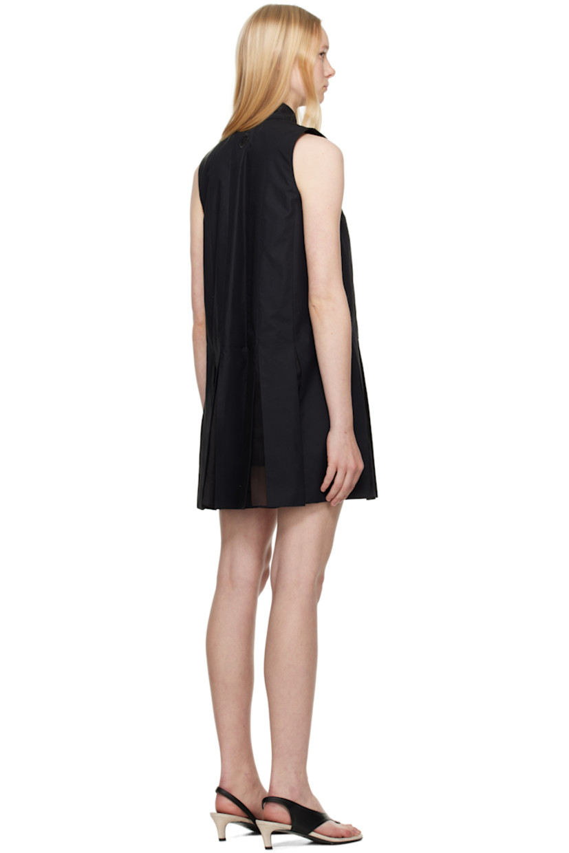 Cotton poplin minidress.

· Spread collar
· Press-stud closure
· Silk organza panels and pleats at hem
· Embroidered logo patch at back collar
· Cotton poplin shorts-style underlay

Supplier color: Black