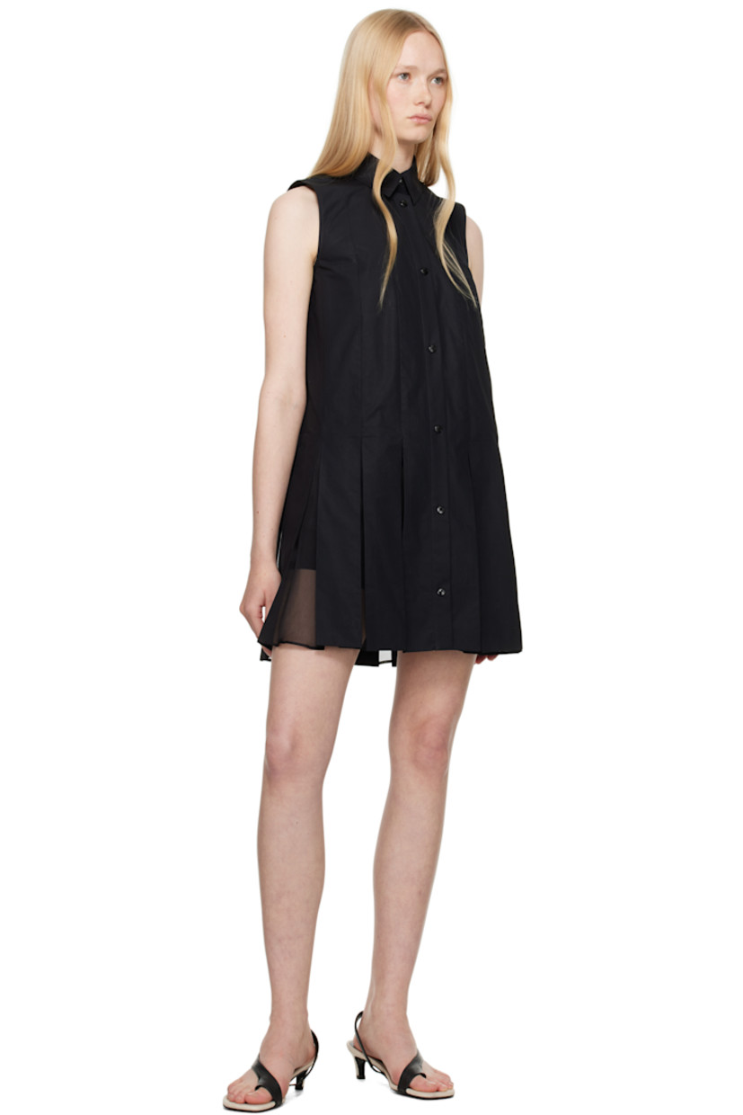 Cotton poplin minidress.

· Spread collar
· Press-stud closure
· Silk organza panels and pleats at hem
· Embroidered logo patch at back collar
· Cotton poplin shorts-style underlay

Supplier color: Black