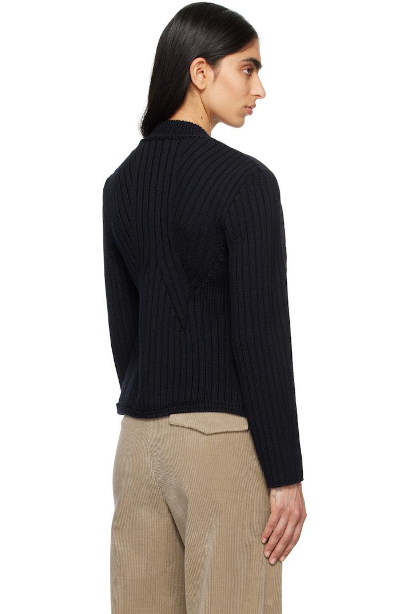Down-filled quilted polyester satin and 7-gauge rib-knit virgin wool cardigan.

· Paneled construction
· Stand collar
· Press-stud closure 
· Patch pockets
· Logo patch at sleeve
· Partial satin lining

Supplier color: Navy blue

Fill: 90% goose down, 10% feather.