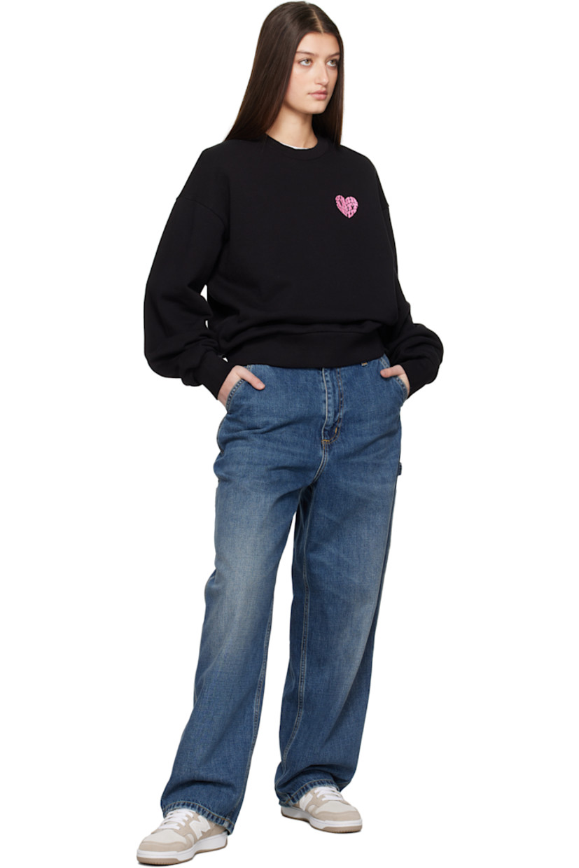 Loose-fit heavyweight French terry sweatshirt. 

· Garment-washed
· Rib-knit crewneck, hem, and cuffs 
· Embroidered logo graphic at chest 
· Dropped shoulders 
· Text and logo graphic printed at back 

Supplier color: Black