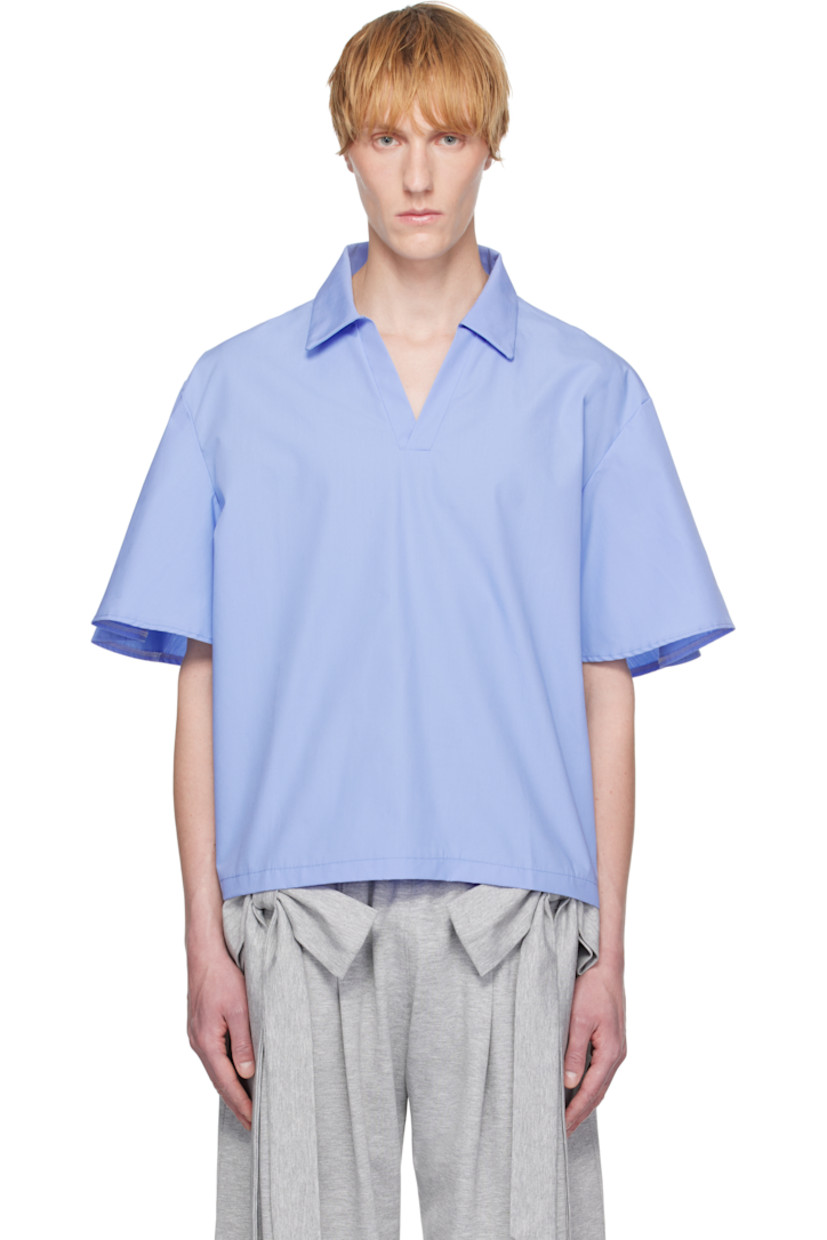 Cotton poplin shirt.

· Spread collar
· Open placket
· Dropped shoulders

Supplier color: Blue